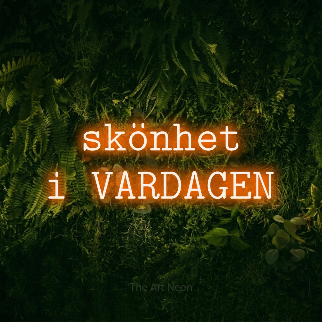LED neon sign reading “skönhet i VARDAGEN”, arranged in 2 lines.
