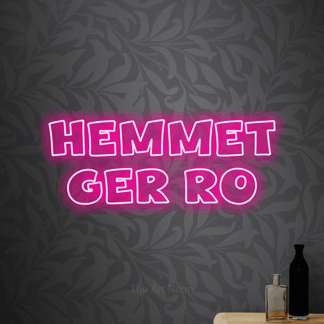 LED neon sign reading “HEMMET GER RO”, arranged in 2 lines.