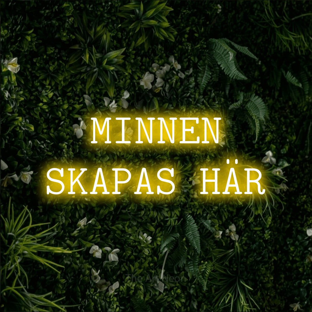 LED neon sign reading “MINNEN SKAPAS HÄR”, arranged in 2 lines.
