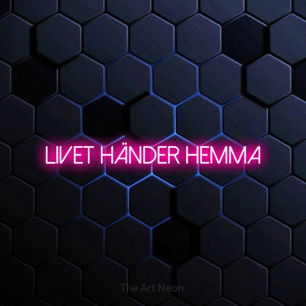 LED neon sign reading “Livet Händer Hemma”, arranged in a single line.
