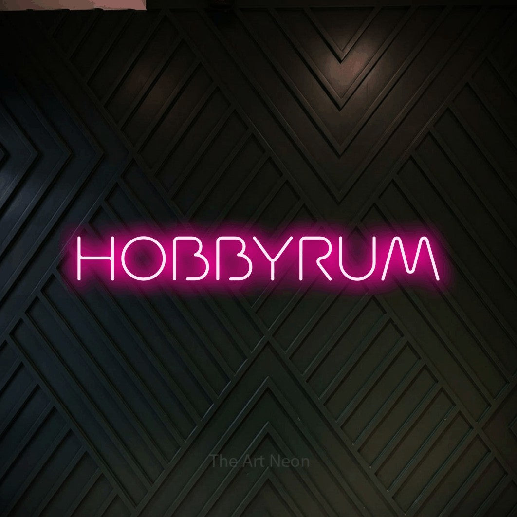 LED neon sign reading “HOBBYRUM”, arranged in a single line.