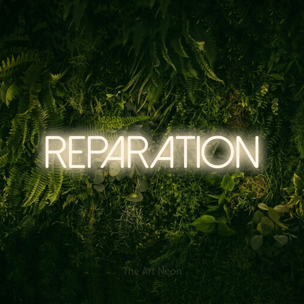 LED neon sign reading “reparation”, arranged in a single line.