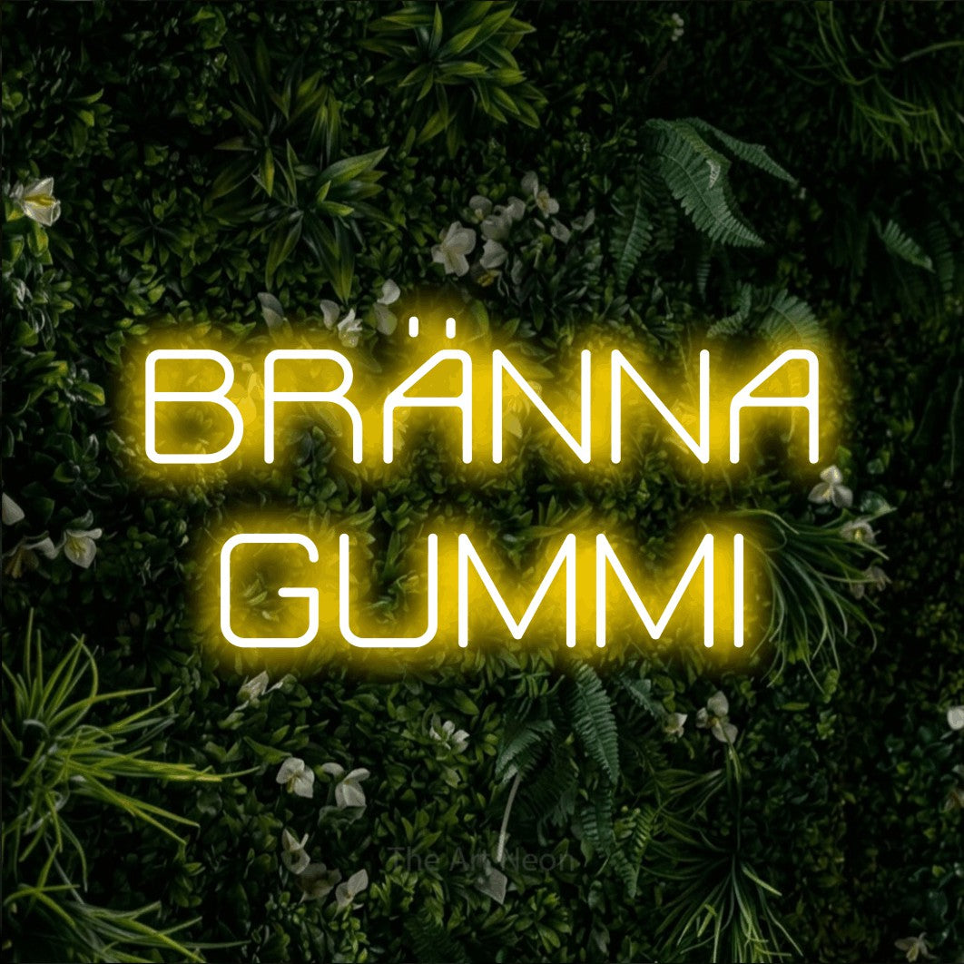 LED neon sign reading “BRÄNNA GUMMI”, arranged in 2 lines.