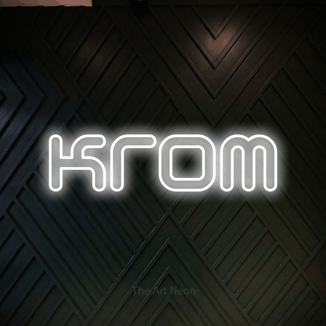 LED neon sign reading “Krom”, arranged in a single line.