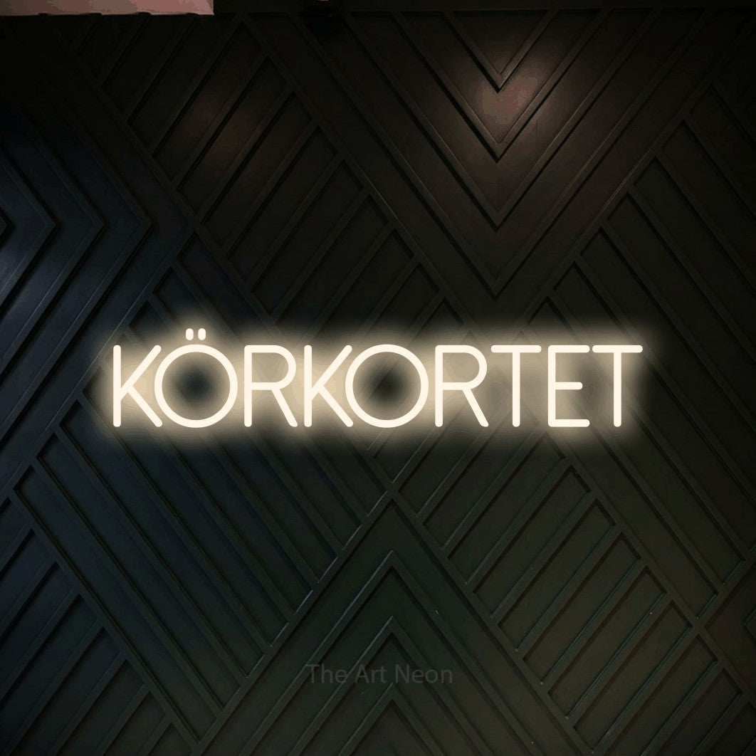 LED neon sign reading “KÖRKORTET”, arranged in a single line.