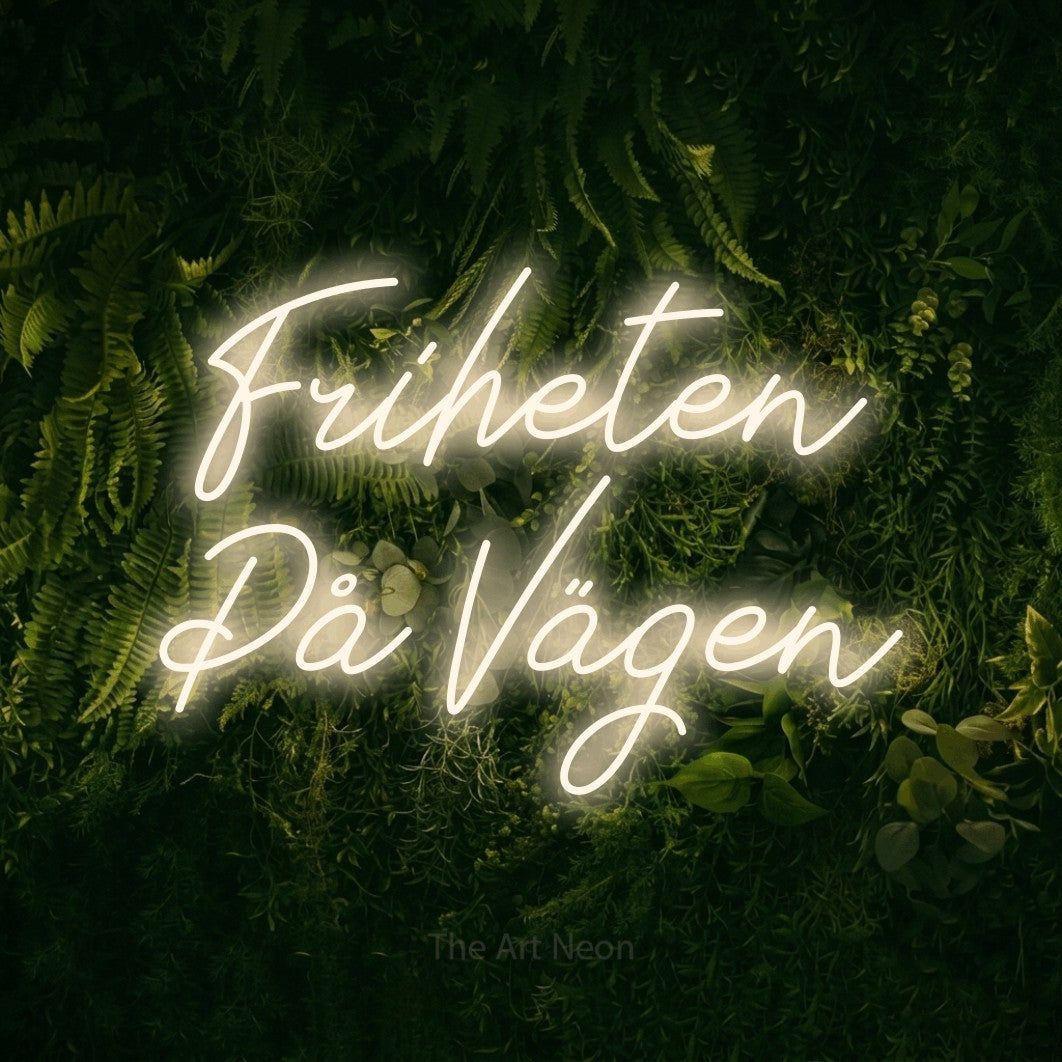 LED neon sign reading “Friheten På Vägen”, arranged in 2 lines.