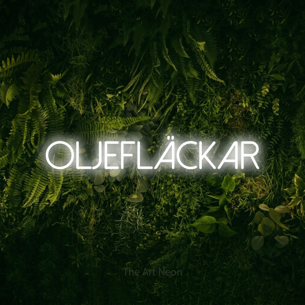 LED neon sign reading “OLJEFLÄCKAR”, arranged in a single line.