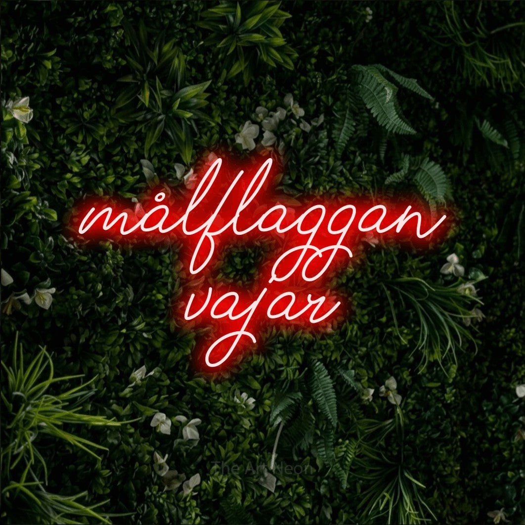 LED neon sign reading “målflaggan vajar”, arranged in 2 lines.
