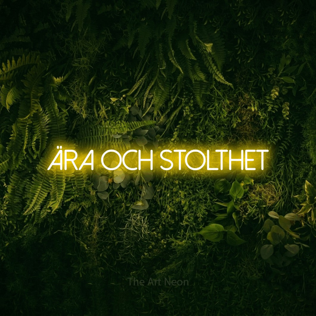 LED neon sign reading “Ära Och Stolthet”, arranged in a single line.
