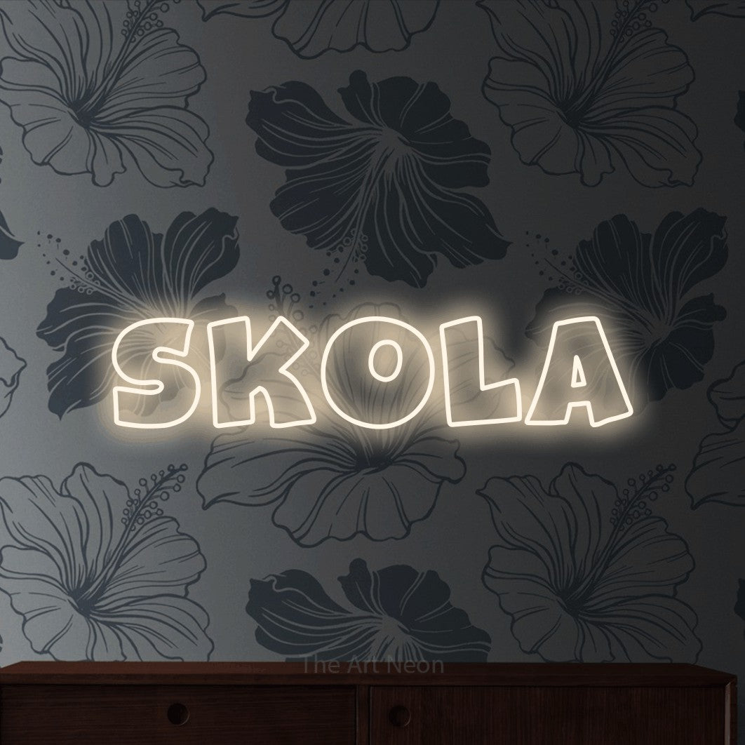 LED neon sign reading “Skola”, arranged in a single line.