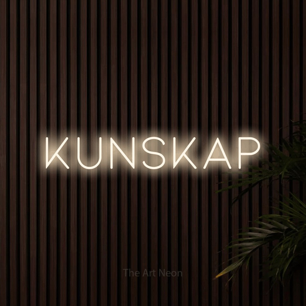 LED neon sign reading “KUNSKAP”, arranged in a single line.