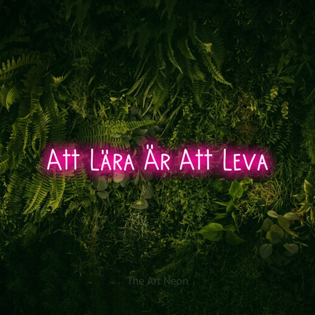 LED neon sign reading “Att Lära Är Att Leva”, arranged in a single line.