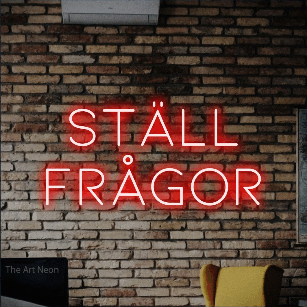 LED neon sign reading “Ställ Frågor”, arranged in 2 lines.