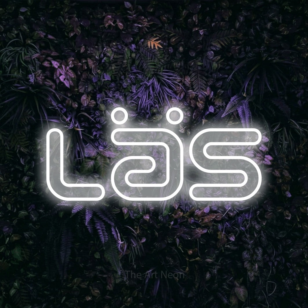 LED neon sign reading “Läs”, arranged in a single line.