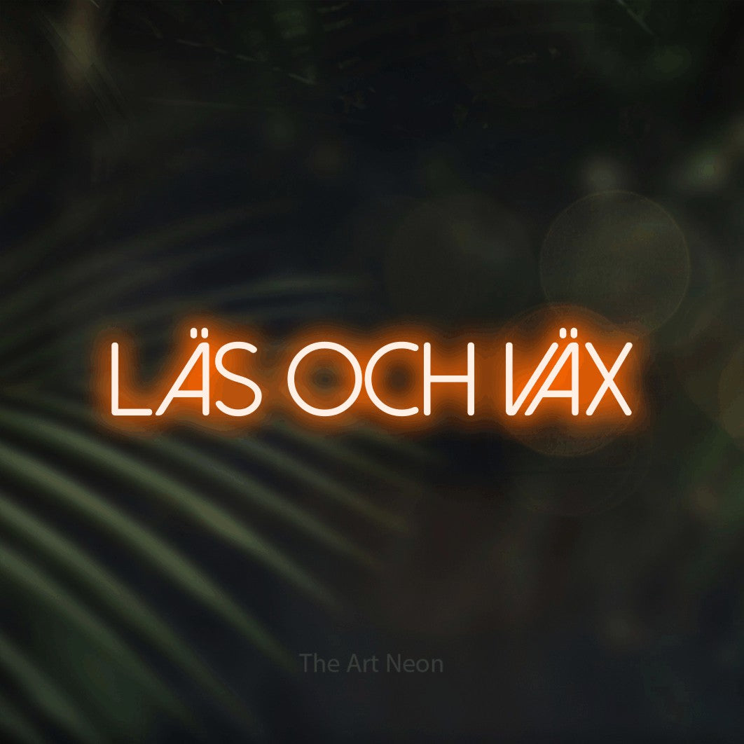 LED neon sign reading “LÄS OCH VÄX”, arranged in a single line.