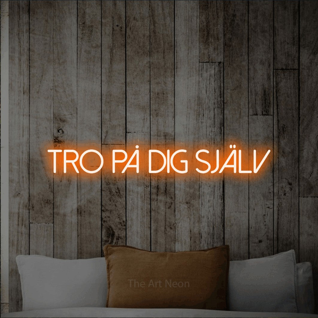 LED neon sign reading “tro på dig själv”, arranged in a single line.