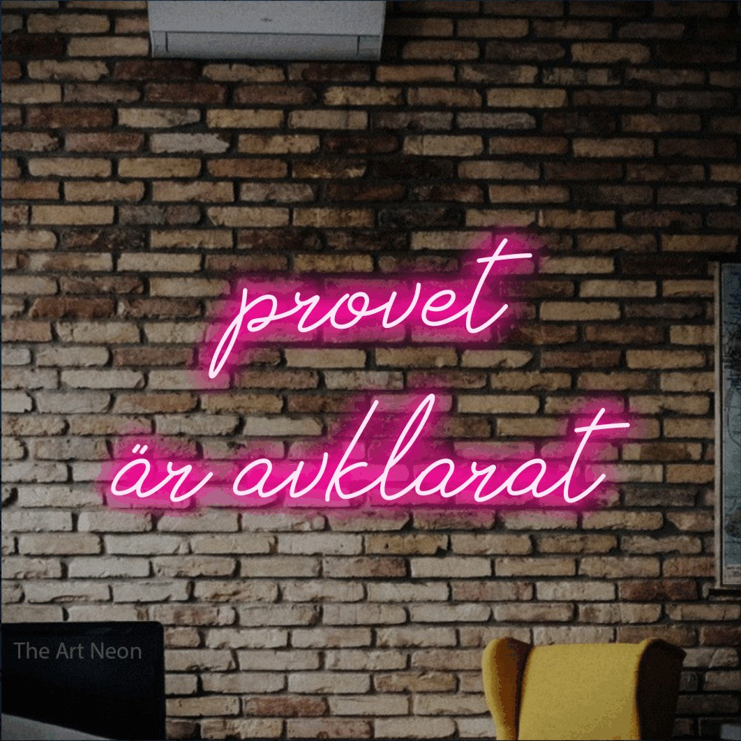 LED neon sign reading “provet är avklarat”, arranged in 2 lines.