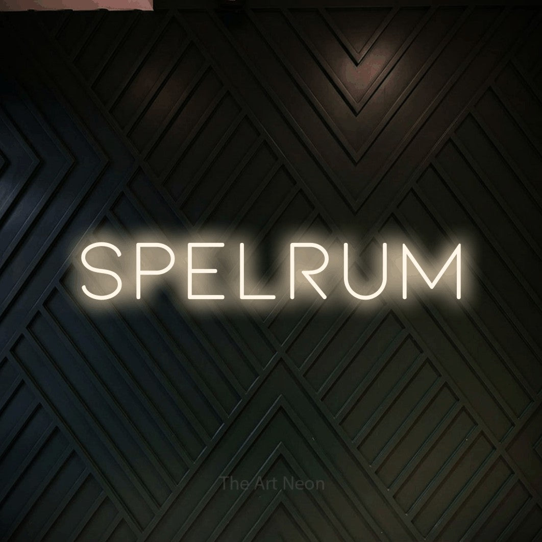 LED neon sign reading “Spelrum”, arranged in a single line.
