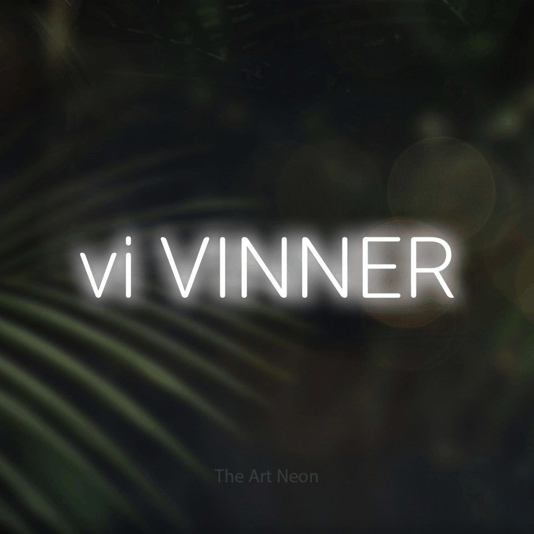 LED neon sign reading “vi VINNER”, arranged in a single line.