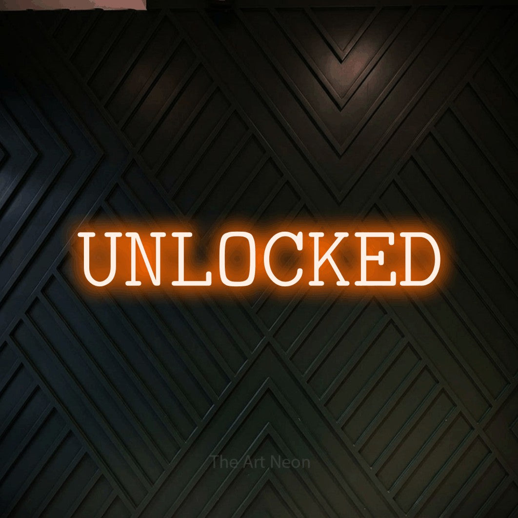LED neon sign reading “UNLOCKED”, arranged in a single line.