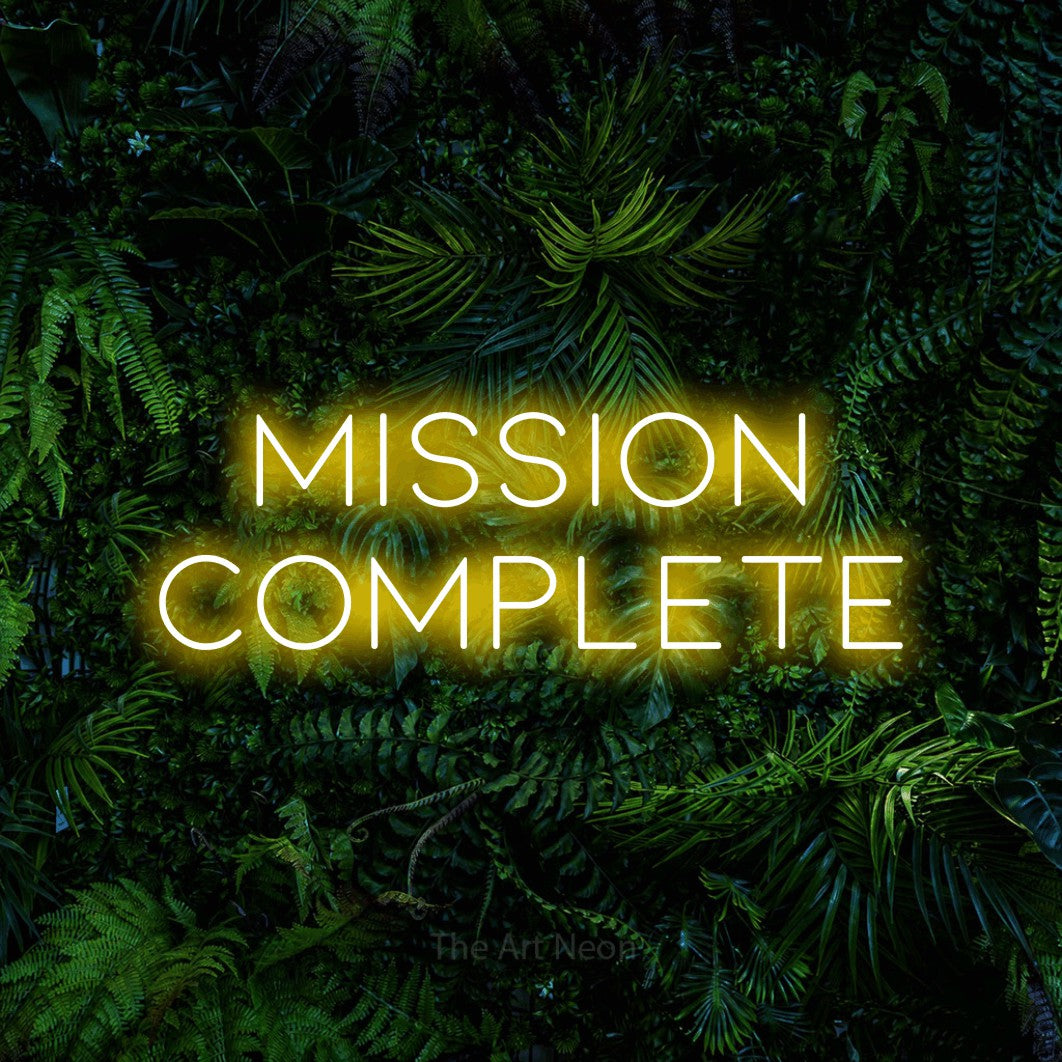 LED neon sign reading “mission COMPLETE”, arranged in 2 lines.