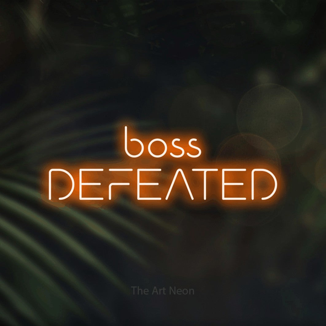LED neon sign reading “boss DEFEATED”, arranged in 2 lines.