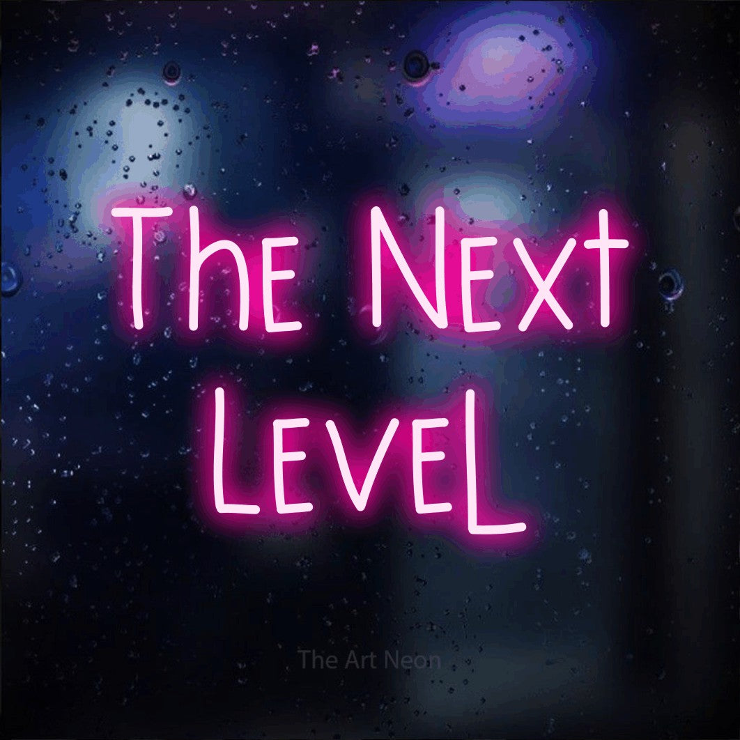LED neon sign reading “The Next Level”, arranged in 2 lines.