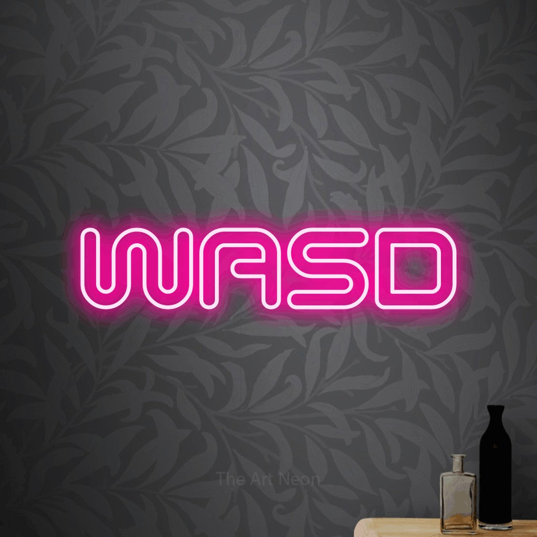 LED neon sign reading “WASD”, arranged in a single line.