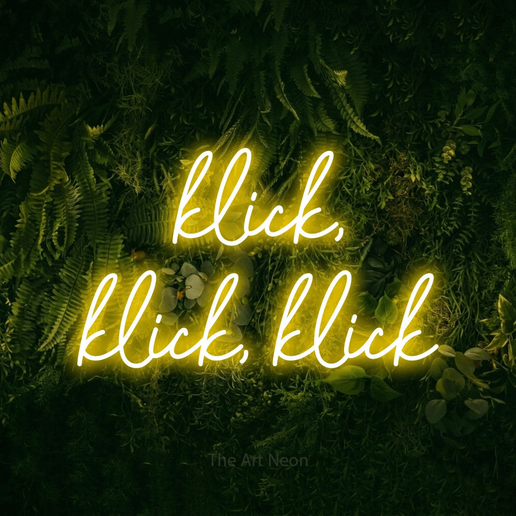 LED neon sign reading “klick, klick, klick”, arranged in 2 lines.