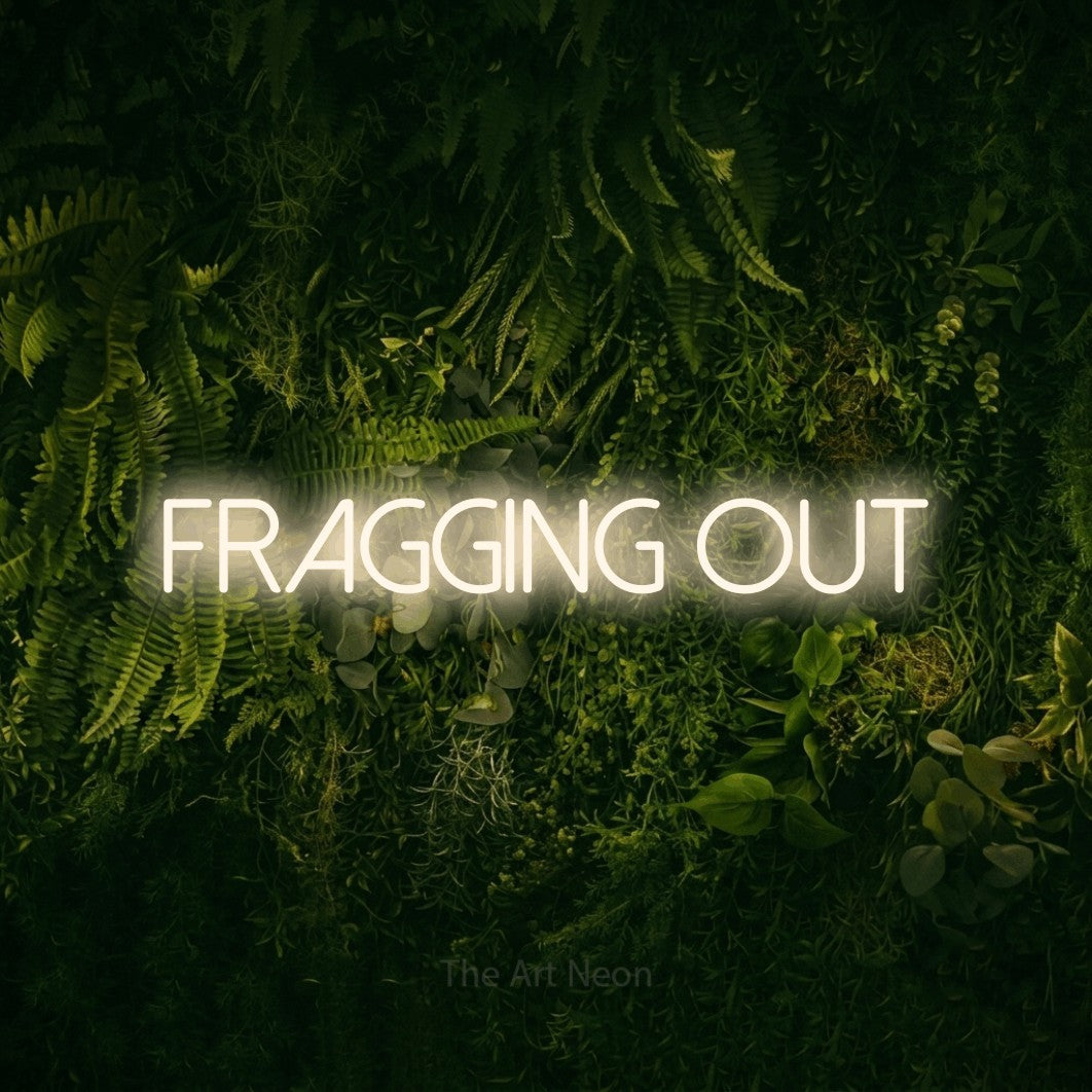 LED neon sign reading “FRAGGING out”, arranged in a single line.