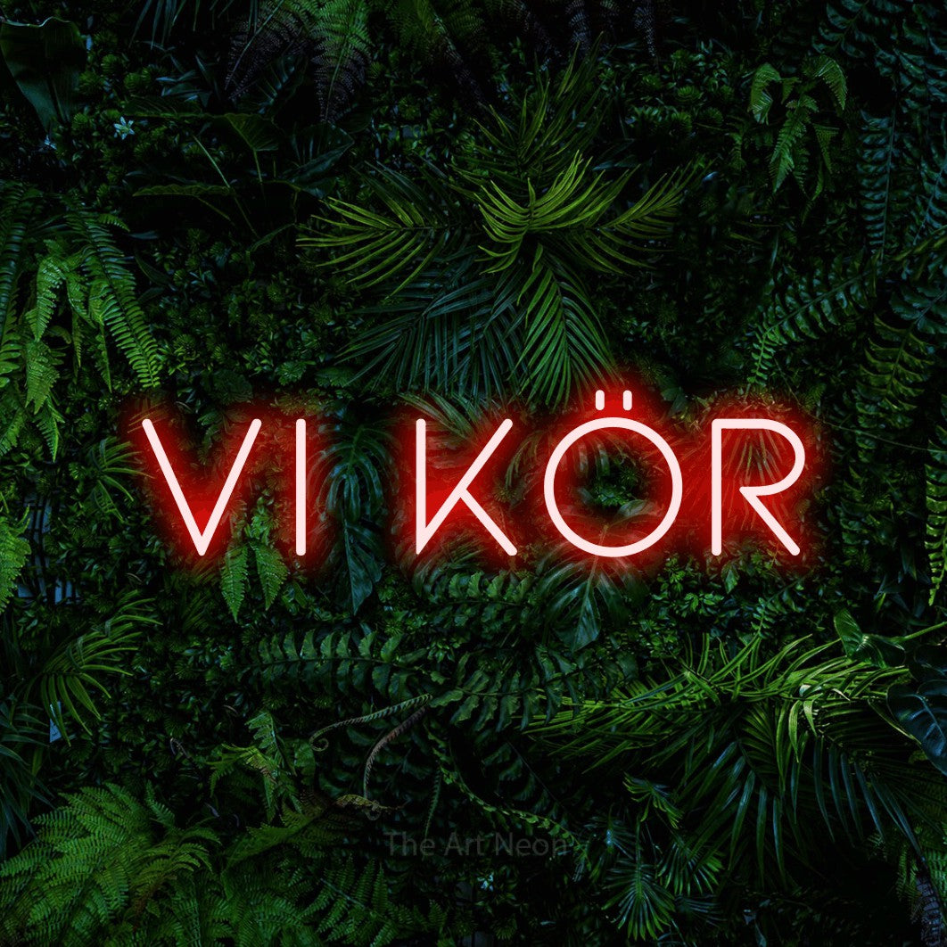 LED neon sign reading “vi kör”, arranged in a single line.