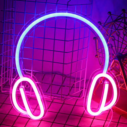 The image features a vibrant, handmade LED neon sign in the shape of headphones.