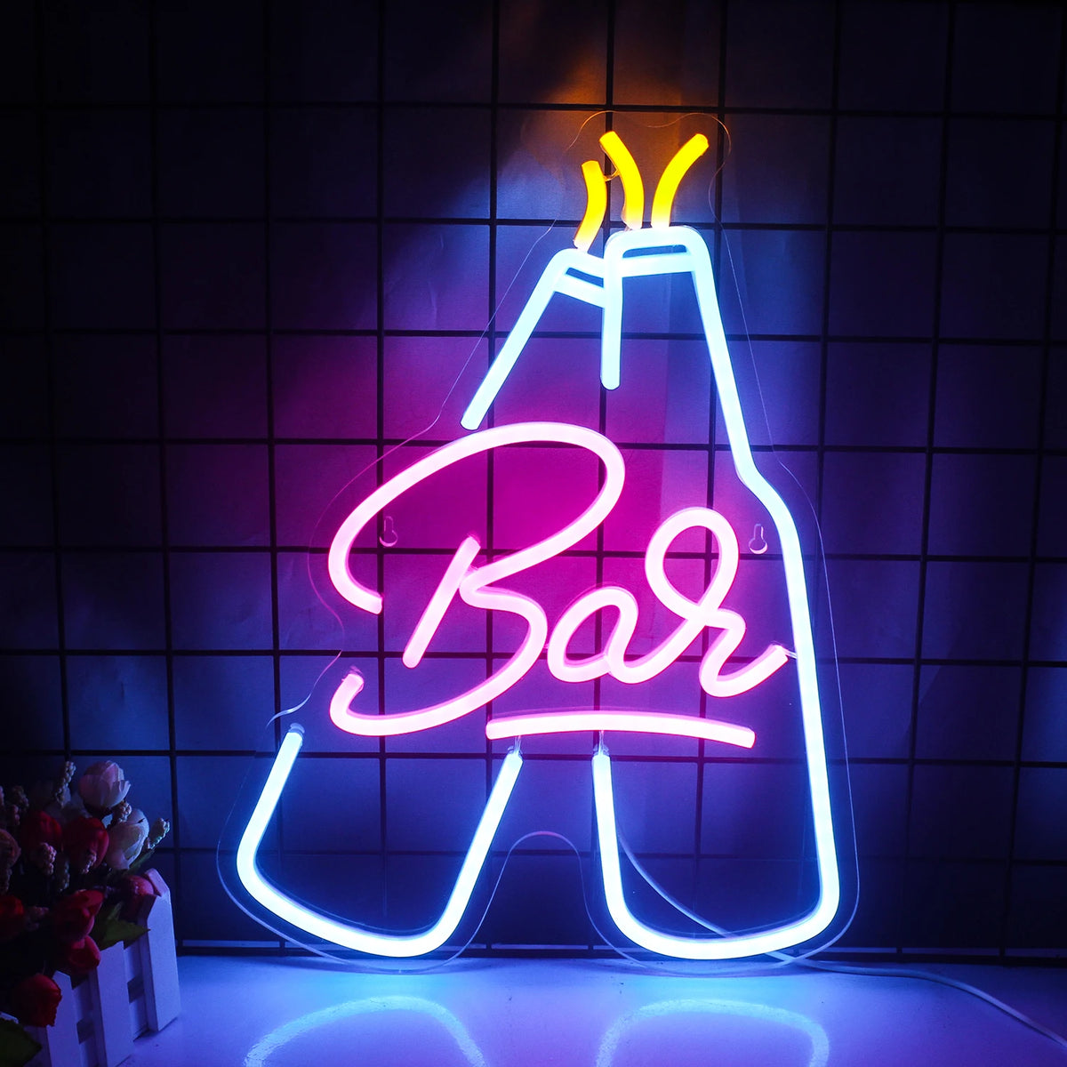 En upplyst LED neonskylt formad som ordet "Bar" i ett stilrent, kursivt typsnitt.