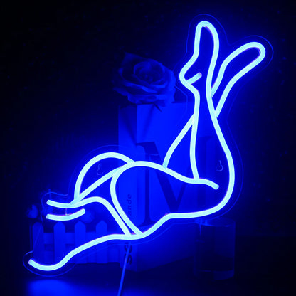 A vibrant LED neon sign depicting a stylized image of a pair of sexy women's legs.