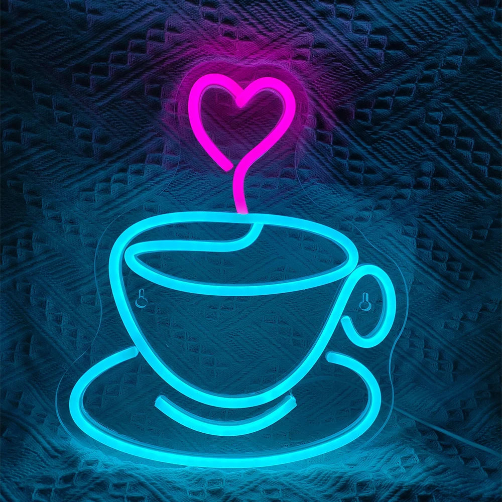 En levande LED neonskylt formad som en kaffekopp med ånga, tillsammans med en hjärtsymbol ovan.
