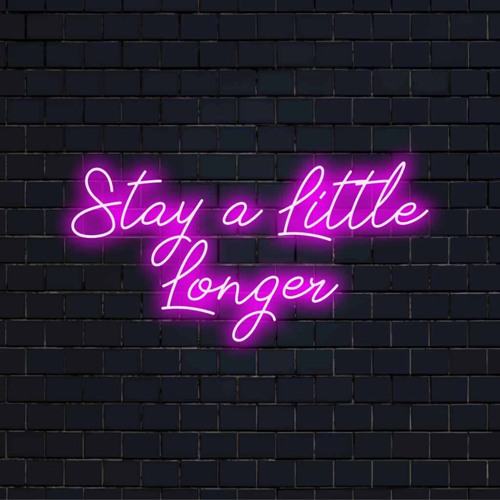 Custom made LED neon sign reading Stay A Little Longer; perfect neon wall art for adding personality to any space.