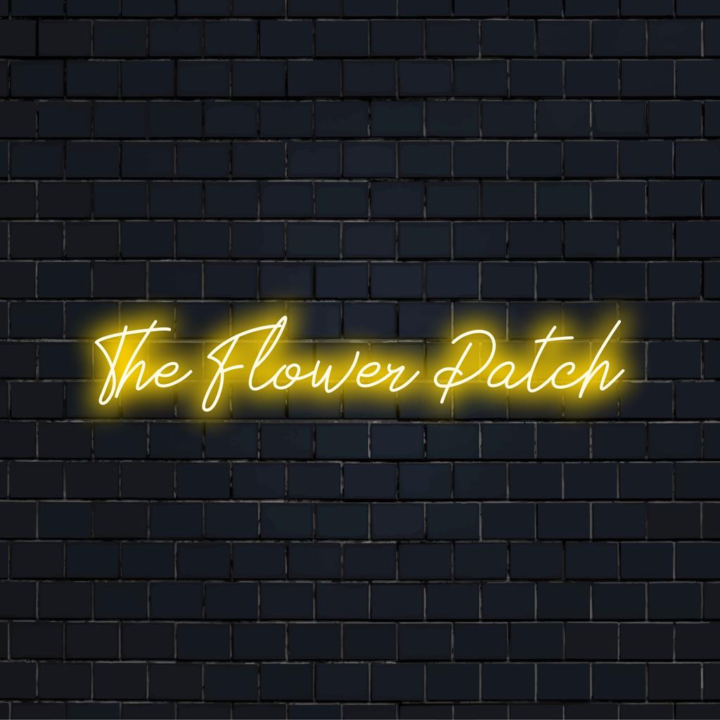 Anpassad LED neonskylt som heter The Flower Patch; levande glöd passar alla utrymmen och visar upp din stil i neonljusdekor.