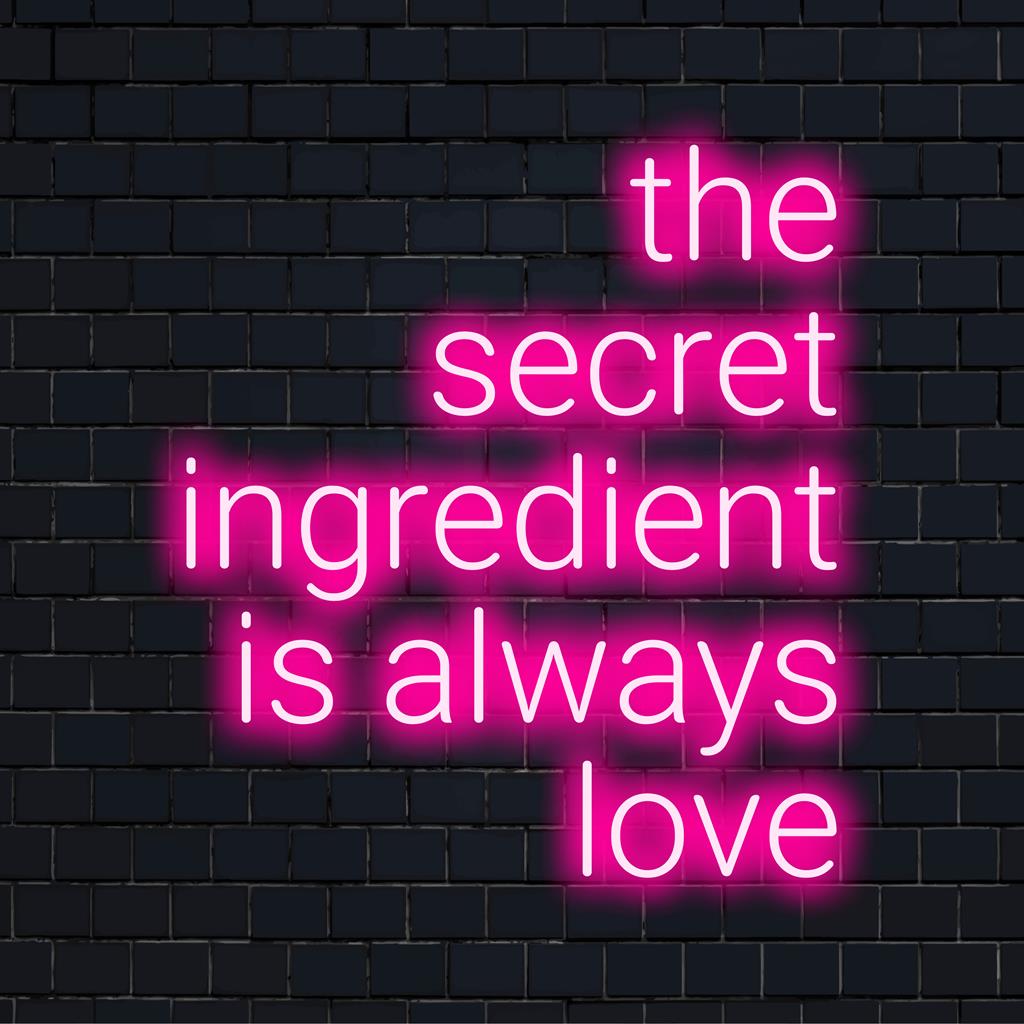 Anpassad LED-neonskylt med The Secret Ingredient Is Always Love i fängslande kursiv, perfekt för alla väggdekorationer.