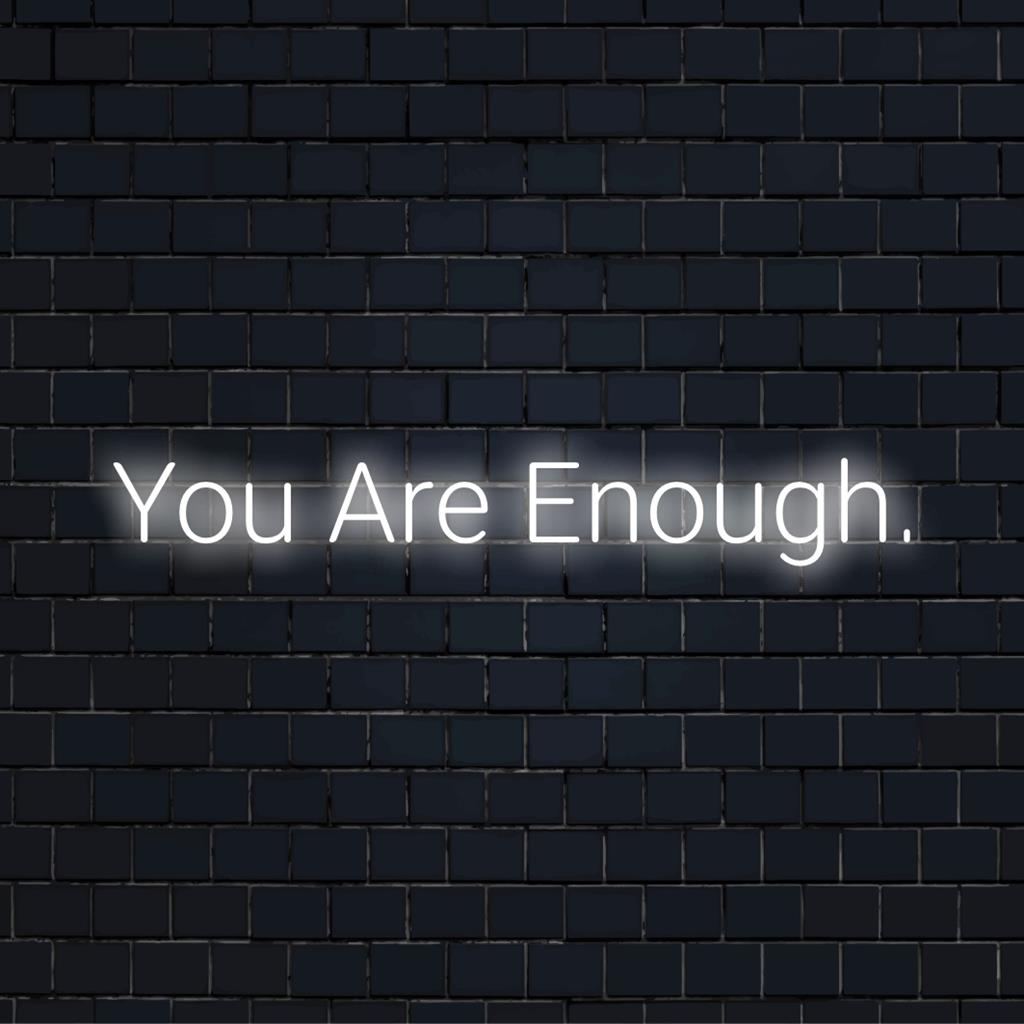 Custom made LED neon sign with text You Are Enough, promoting self-love. Stylish neon light decor for personal motivation.
