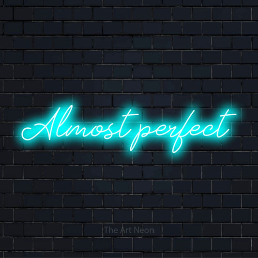 "Almost Perfect" text design with neon effect on a black brick wall