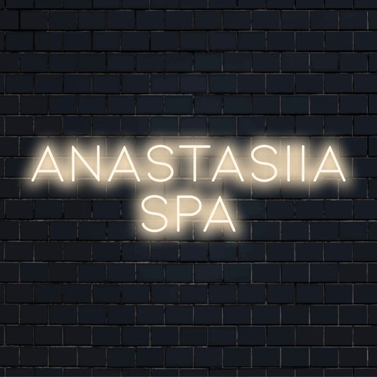 Anastasiia Spa Personalized LED Neon Sign, glowing wall decor against brick backdrop