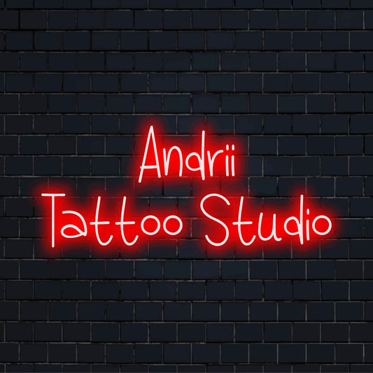 Andrii Tattoo Studio Personalized LED Neon Sign, glowing neon text on dark brick background