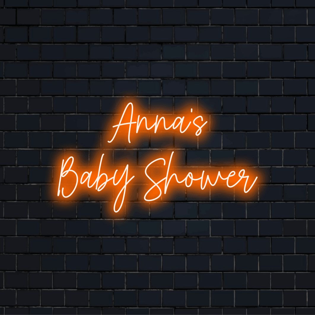 Anna_s Baby Shower Personalized Neon Light with bright neon lettering on dark brick background