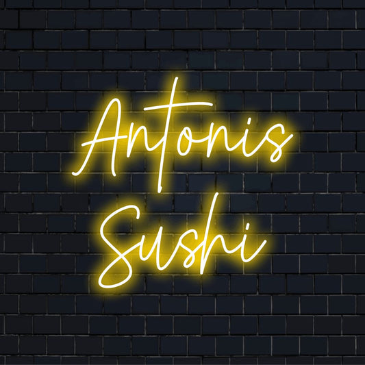 Antonis Sushi Personalized Neon Light with neon text light on dark brick background