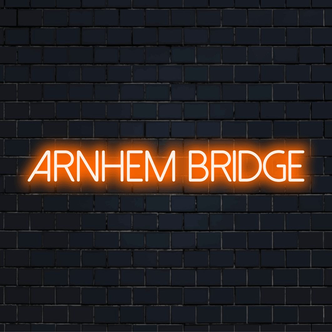 Arnhem Bridge Neon Sign, glowing neon text against black brick wall