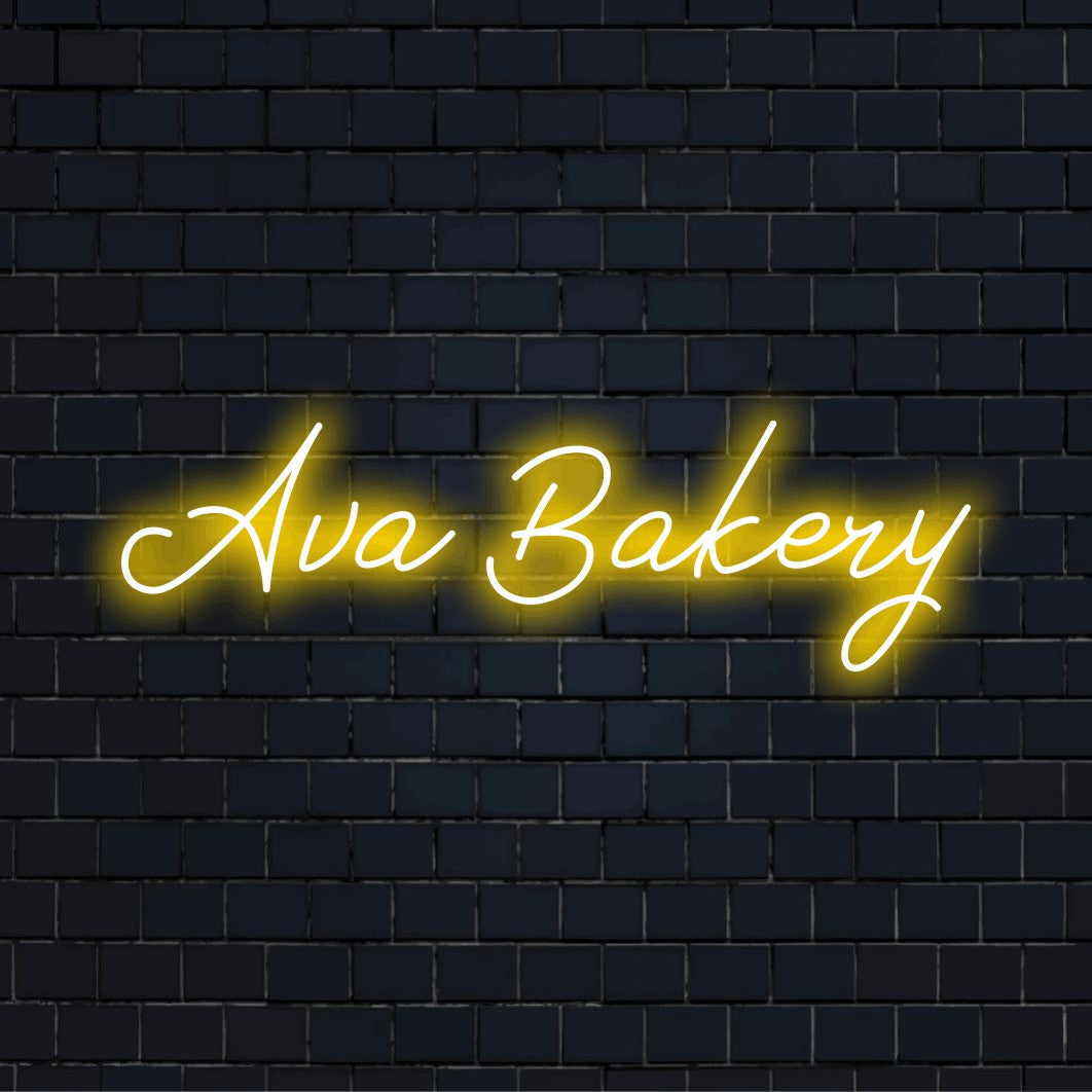 Ava Bakery Personalized Neon Light with glowing neon text against brick backdrop