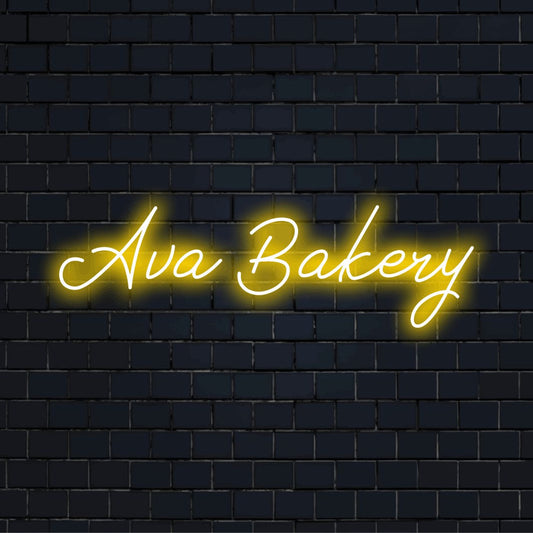 Ava Bakery Personalized Neon Light with glowing neon text against brick backdrop
