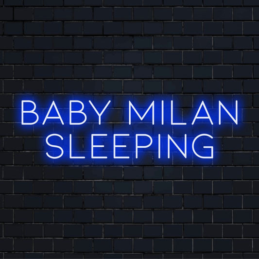 Baby Milan Sleeping Custom Name Neon Sign, glowing wall decor on dark brick wall