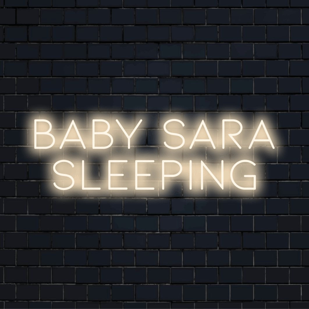 Baby Sara Sleeping Custom Name Neon Sign, glowing wall decor on black brick background