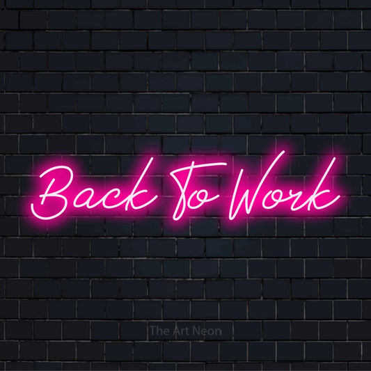 "Back To Work" LED neon sign on a black brick wall
